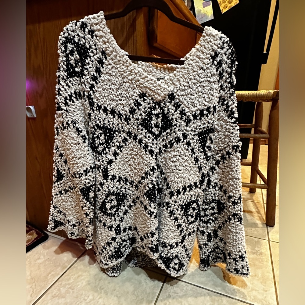 Black and white womens sweater size S/M. Brand is Miracle USA